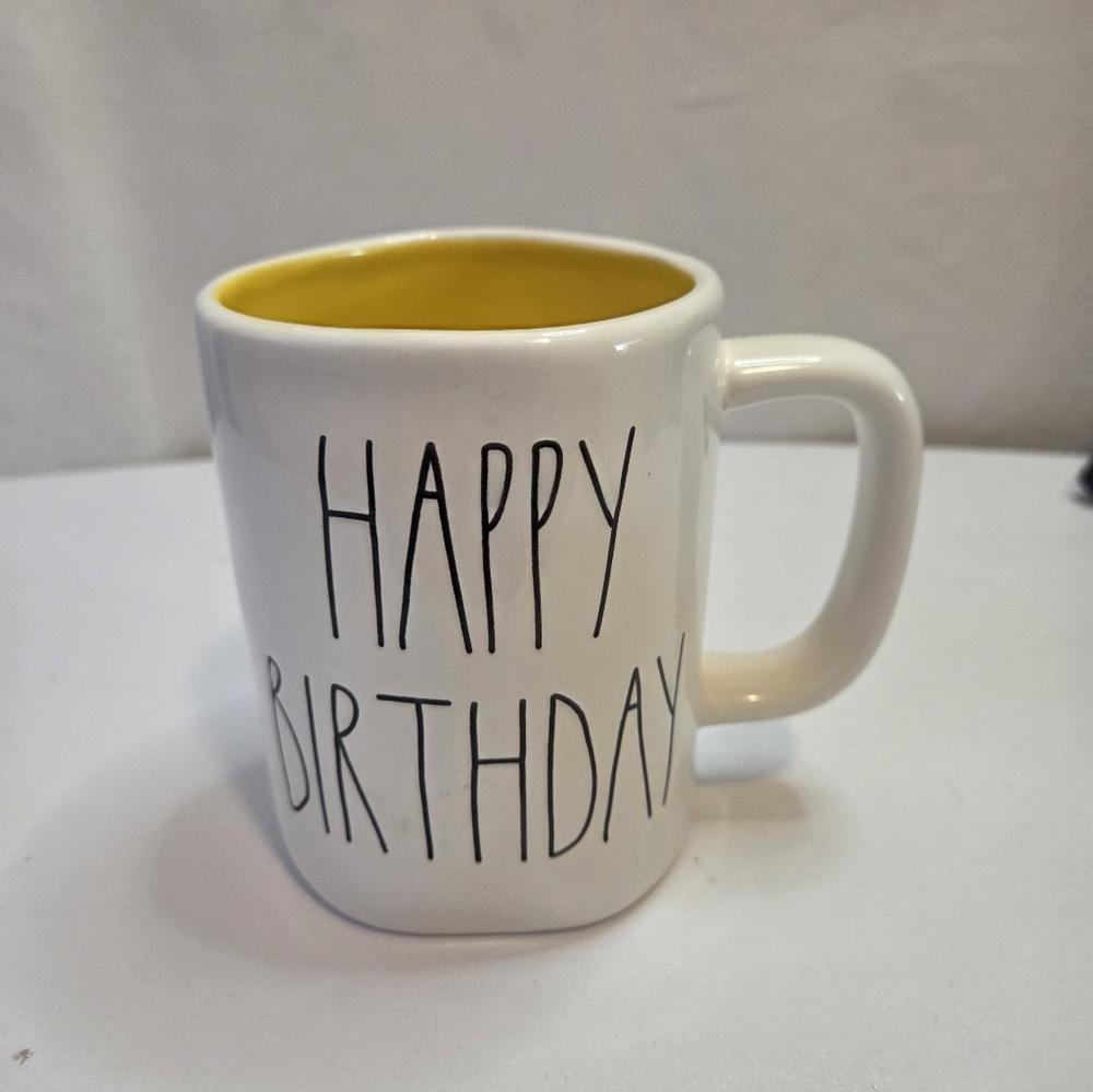 Rae Dunn Happy Birthday Mug Yellow inside.